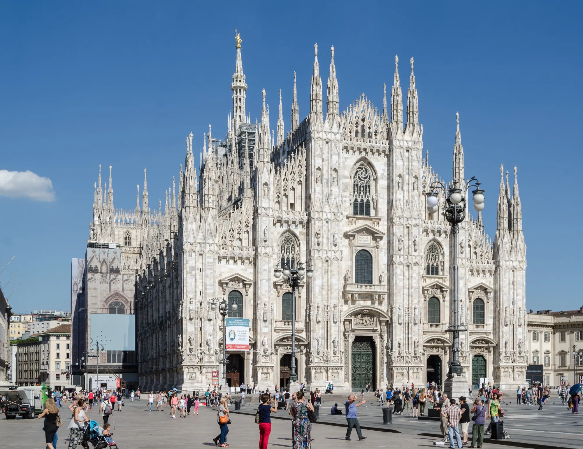 Milan Cathedral facade on a sunny day, seen across Piazza del Duomo